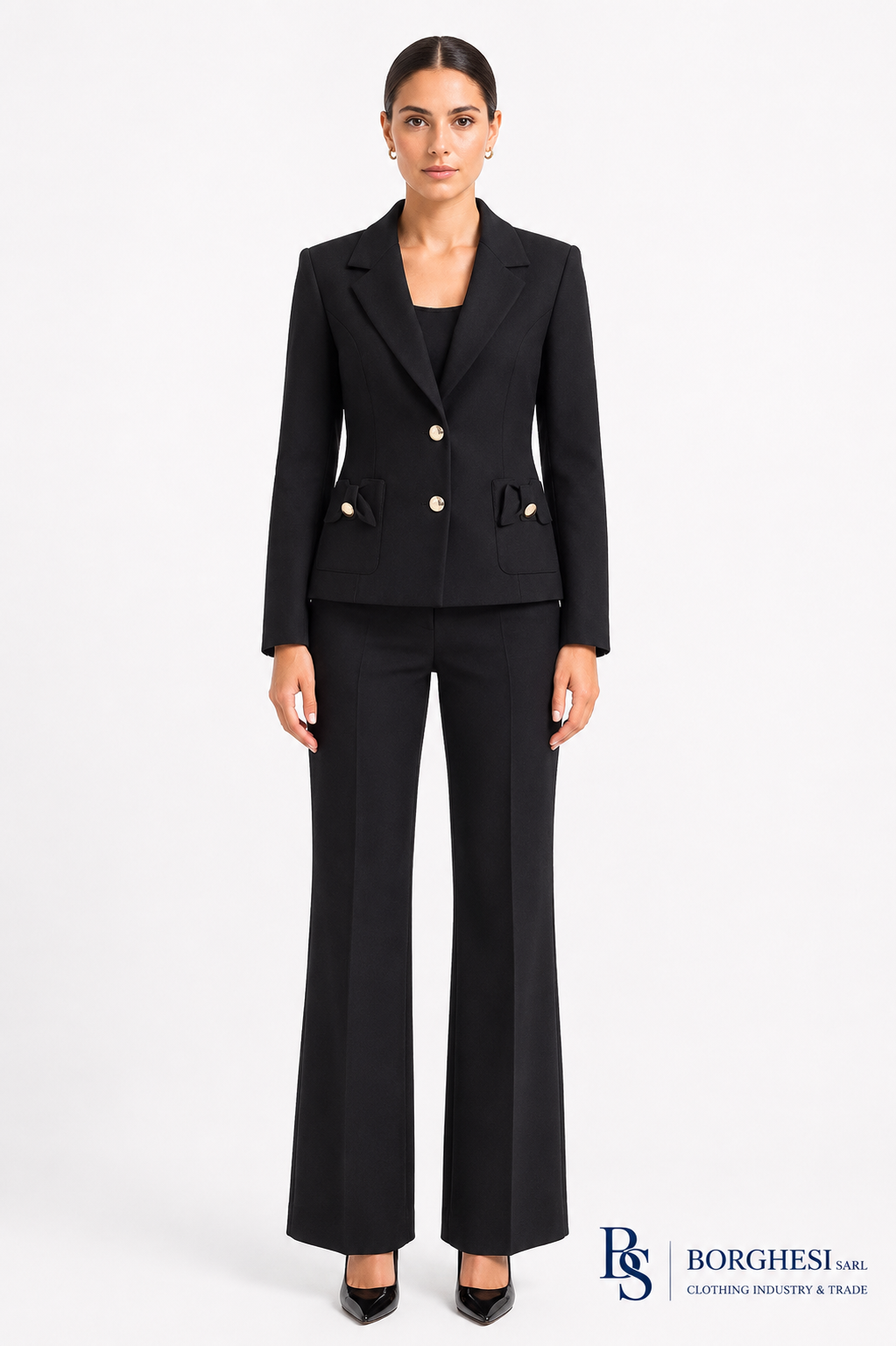 Women's black tailored blazer with gold buttons and bow-detail pockets, worn with flared trousers